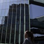 Fannie Mae Unlocks New Era: Crypto-Backed Mortgages Pave Way for Digital Homeownership 4 Illustration of a house with cryptocurrency symbols and a digital padlock, representing crypto-backed mortgages.