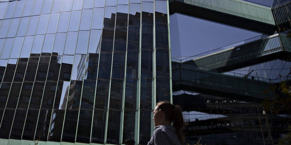 Illustration of a house with cryptocurrency symbols and a digital padlock, representing crypto-backed mortgages.