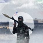 صورة لمبنى سفارة أو منطقة دبلوماسية في بغداد مع إشارة إلى التوتر الأمني.