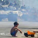 صورة لأطفال يتأثرون بالصراعات المسلحة، مع التأكيد على ضرورة الدعم النفسي لحمايتهم.