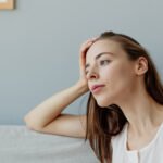 Beyond the Binge: How Your TV Habits Could Impact Dementia Risk – And 5 Brain-Boosting Alternatives 6 A person sitting on a couch, engrossed in watching television, with a subtle glow from the screen on their face, symbolizing passive screen time.