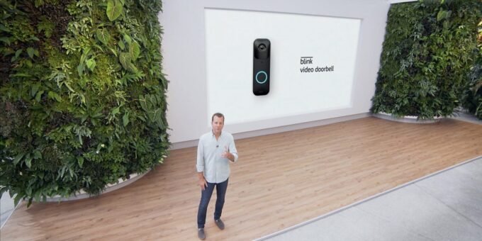 The Unseen Watchman: How Doorbell Cameras Could Be Key to Solving High-Profile Crimes 7 Ring CEO Jamie Siminoff discussing the role of doorbell cameras in crime investigations, with a blurred image of a home security camera in the background.