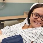 Beyond the Belly Ache: A 20-Year-Old's Journey to a Stage 2 Colon Cancer Diagnosis 6 A young woman experiencing stomach pain, symbolizing the early symptoms of colon cancer.