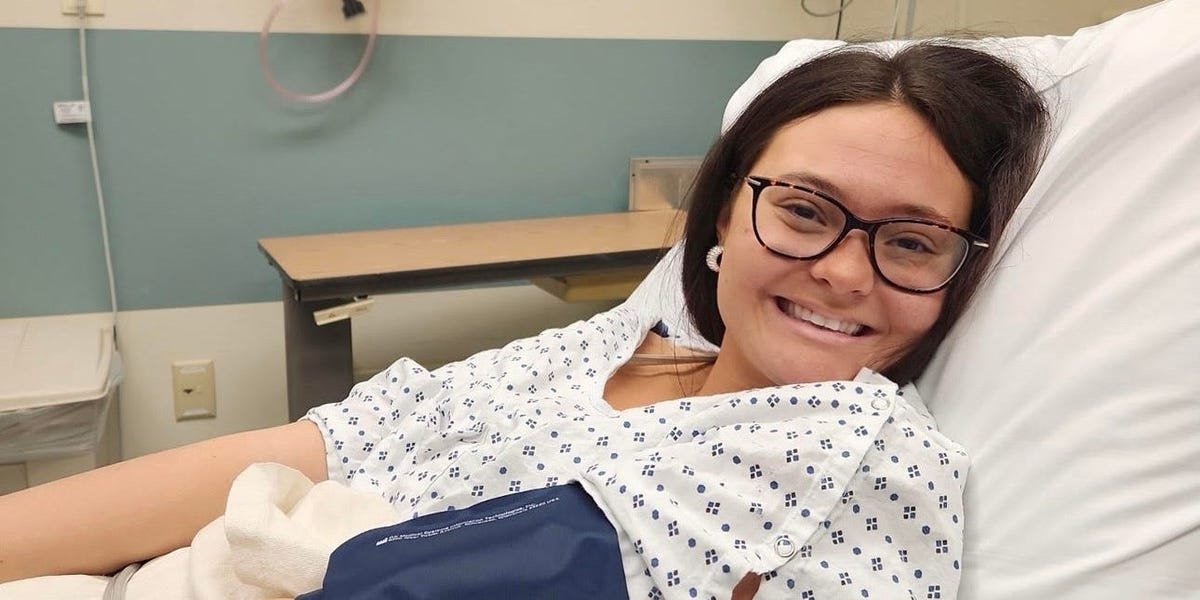 Beyond the Belly Ache: A 20-Year-Old's Journey to a Stage 2 Colon Cancer Diagnosis 3 A young woman experiencing stomach pain, symbolizing the early symptoms of colon cancer.