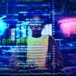 An entrepreneur thoughtfully crafting an AI prompt on a laptop, surrounded by visual representations of data and strategy.