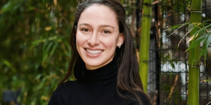 An abstract representation of AI interacting with the physical world, possibly showing a robot hand manipulating objects in a complex simulated environment.