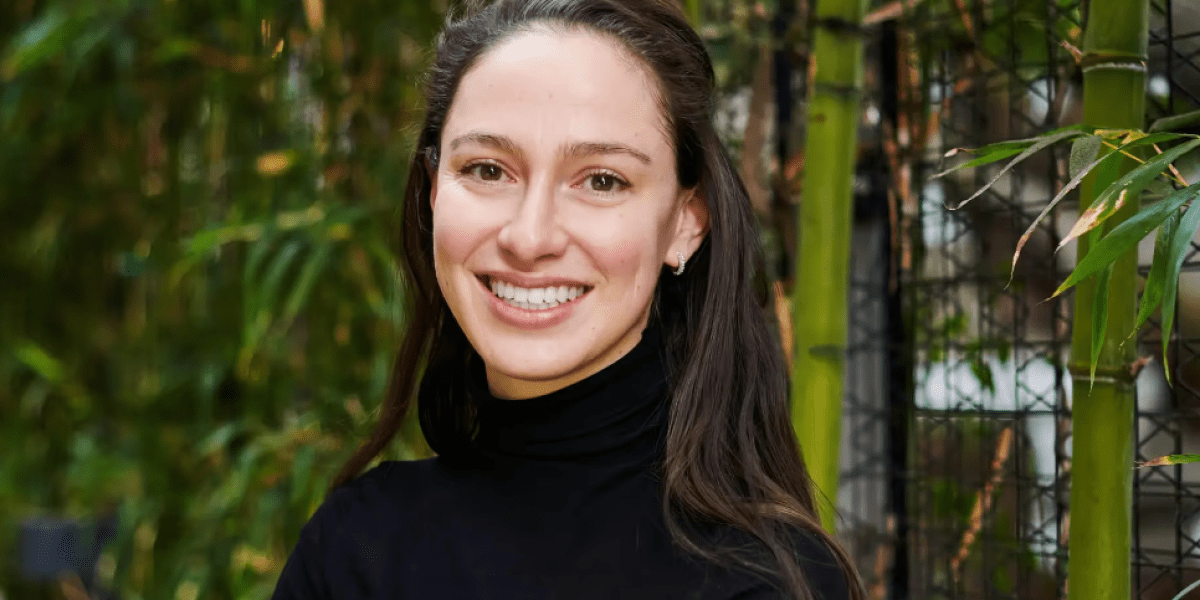 An abstract representation of AI interacting with the physical world, possibly showing a robot hand manipulating objects in a complex simulated environment.