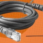 Neatly organized Ethernet cables connecting to a network switch, illustrating effective cable management.