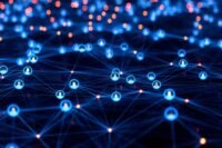 A globe surrounded by business icons, symbolizing global expansion and interconnected workforce models.