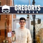 From Juris Doctor to Java Juggernaut: How Gregory Zamfotis Built a $40M Coffee Empire 8 Gregory Zamfotis, CEO and founder of Gregorys Coffee, standing in one of his successful coffee shops.