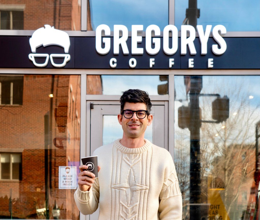From Juris Doctor to Java Juggernaut: How Gregory Zamfotis Built a $40M Coffee Empire 3 Gregory Zamfotis, CEO and founder of Gregorys Coffee, standing in one of his successful coffee shops.