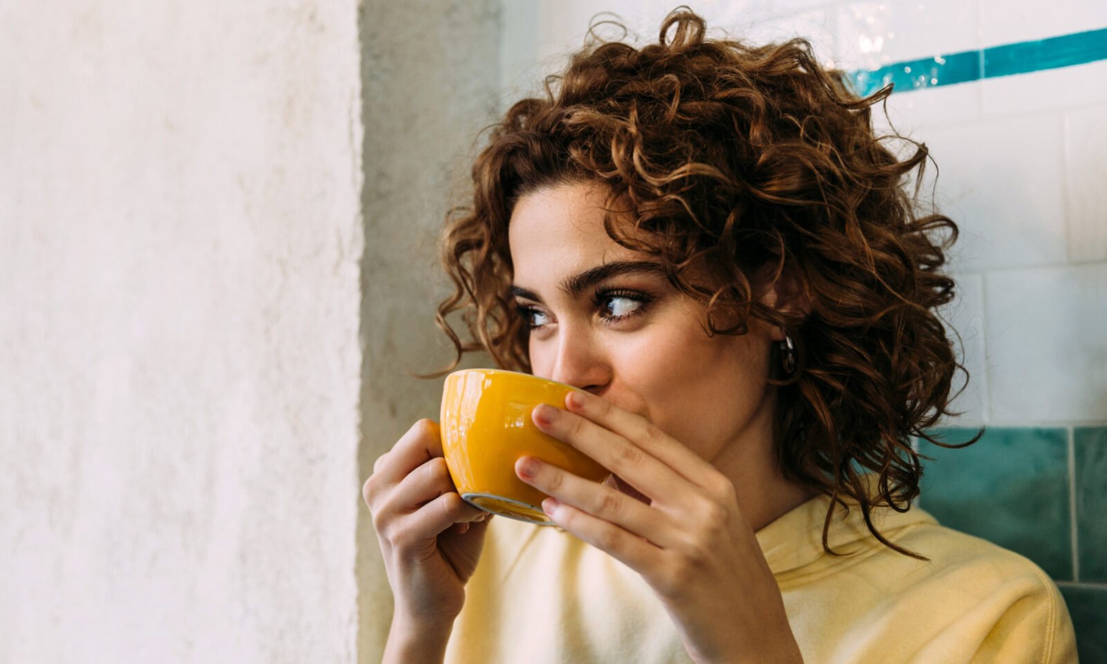 Vibrant hibiscus tea in a mug, symbolizing natural skin health and anti-aging benefits.