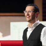 From History Buff to Shark Tank Success: How One Man's Passion for the Past Built a Million-Dollar Business 6 Ari Siegel, founder of History By Mail, holding historical document replicas