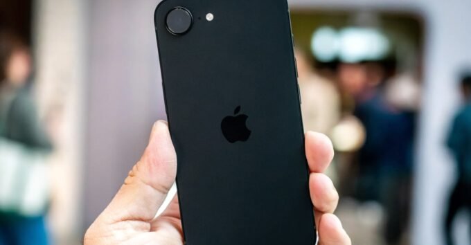 iPhone 17e Hands-On: Apple's Budget Contender Delivers Practical Upgrades 5 Nilay Patel holding the new iPhone 17e at Apple's media event