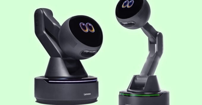 Lenovo AI Workmate Concept: A robotic arm with a screen displaying expressive eyes, designed for desktop productivity.