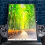 A Lenovo Legion Go Fold Concept handheld device, shown in its standard 7.7-inch folded mode with detachable controllers.