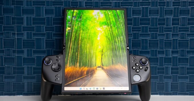 Lenovo's Legion Go Fold: The Windows Gaming Handheld That Transforms into a Laptop 5 A Lenovo Legion Go Fold Concept handheld device, shown in its standard 7.7-inch folded mode with detachable controllers.