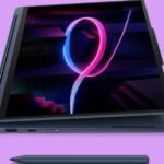 The Lenovo Yoga 9i 2-in-1 laptop in its traditional form, showcasing its blue finish.