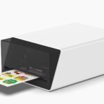 The Liene PixCut S1 portable sticker printer and cutter producing a vibrant, custom sticker.