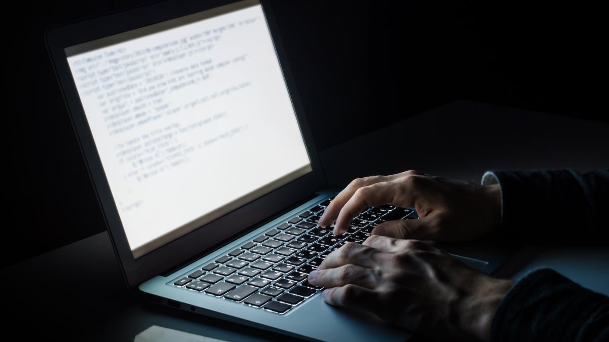 Illustration of a computer system with various legitimate tools being exploited by a hidden threat, representing Living Off the Land attacks.