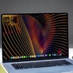 A MacBook Air M5 laptop positioned between a MacBook Neo and a MacBook Pro, illustrating Apple's laptop lineup.