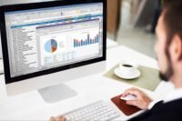 Microsoft Office 2024 Home & Business suite applications displayed on a Microsoft Surface SE 11.6-inch laptop, emphasizing productivity and affordability for entrepreneurs.