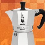 Moka Pot Magic: The Enduring Simplicity of Stovetop Coffee Perfection 8 A classic silver Bialetti Moka Express coffee maker on a stovetop, brewing coffee.
