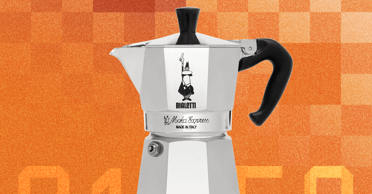 A classic silver Bialetti Moka Express coffee maker on a stovetop, brewing coffee.