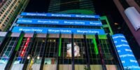 Morgan Stanley headquarters building with company logo against a city skyline.