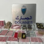 Moroccan customs and police officials inspecting a Fiat Doblo vehicle at the Bab Sebta border crossing after seizing hidden chira.