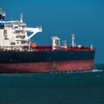 The Perseus Star crude oil tanker departing the Port of Corpus Christi, Texas, amidst global market uncertainty.