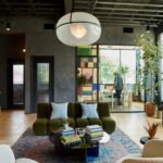 Powell's Nashville HQ: A Masterclass in Design and Local Craftsmanship 4 Interior view of Powell's modern office headquarters in Nashville, featuring custom furnishings, local artisan works, and vibrant design elements.