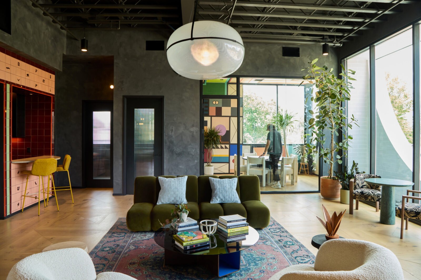 Interior view of Powell's modern office headquarters in Nashville, featuring custom furnishings, local artisan works, and vibrant design elements.