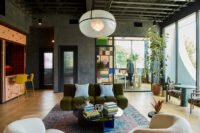 Interior view of Powell's modern office headquarters in Nashville, featuring custom furnishings, local artisan works, and vibrant design elements.