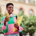 Illustration of student loan documents or a calculator, symbolizing the new RAP repayment plan changes.