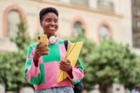 Illustration of student loan documents or a calculator, symbolizing the new RAP repayment plan changes.