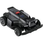 A Segway Navimow X4 robot lawnmower autonomously cutting grass in a backyard.