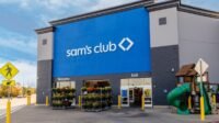 Sam's Club logo with shopping cart full of diverse products, symbolizing bulk savings and convenience for spring refresh.