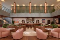 The striking mid-century facade of the Municipal Grand Hotel in Savannah, showcasing its unique blend of tropical modernist and Nordic design elements.