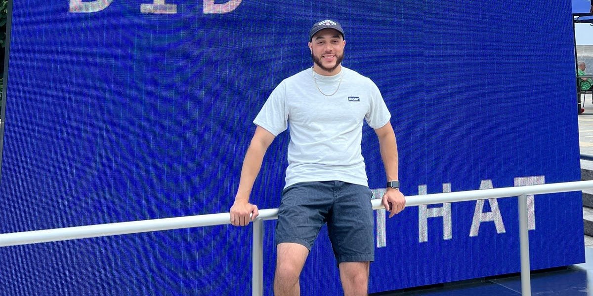 A person looking at a laptop screen with code, symbolizing a software engineer searching for jobs after a layoff.