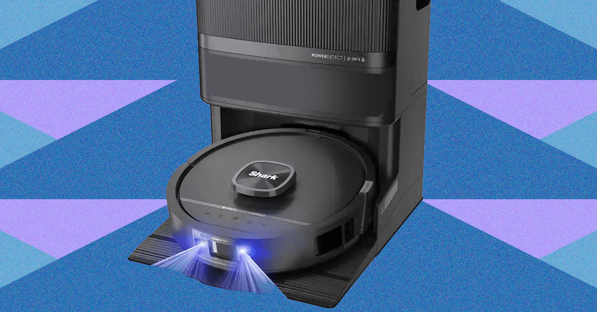Shark PowerDetect UV Reveal robot vacuum with blue UV light activated, cleaning a hard floor.