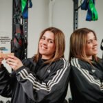 Sihem El Mandoudi, founder of Studio El Mando, holding her 'Most Remarkable Entrepreneur' award.