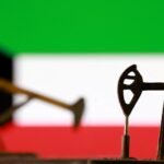 Oil tanker navigating the Strait of Hormuz with a backdrop of Middle Eastern coastline