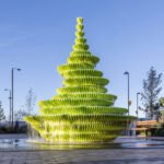 The Fountain by Neon, a multi-tiered, lime-green public water feature cascading water in Brent Cross Town, London.