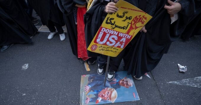 A graphic depicting the flags of the United States and Iran, symbolizing the geopolitical conflict, with a backdrop of a map of the Middle East.