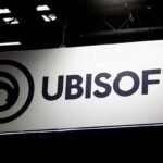 Ubisoft Red Storm Entertainment logo with a backdrop of game development tools