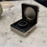 The Ultrahuman Ring Pro: A Smart Ring with an Even Smarter Charging Case 4 The Ultrahuman Ring Pro smart ring magnetically attached to its innovative, feature-filled charging case.