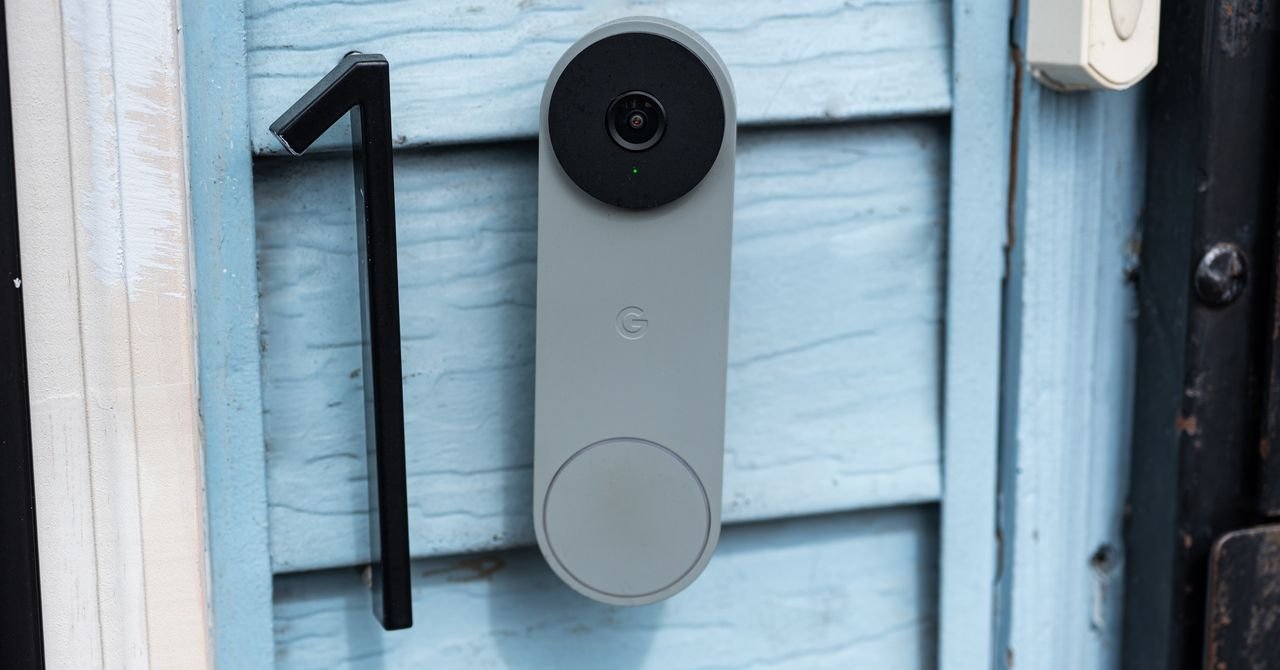 A sleek, modern video doorbell camera mounted on a front door, showing a wide-angle view of a package delivery.