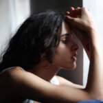 Illustration depicting the link between sunlight, vitamin D, and a person's mood or mental well-being.