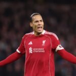 Wolves and Liverpool players battling for possession during an FA Cup match at Molineux Stadium.